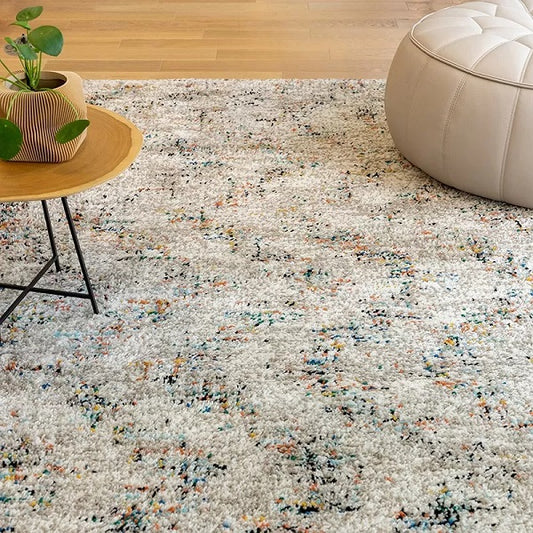 Tapis crème avec des touches de couleur façon "chevron"